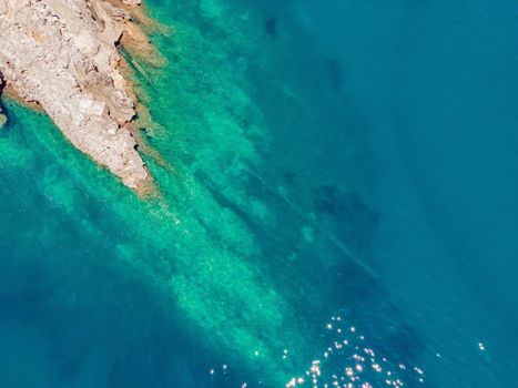 The pipe drains the sewer into the sea. Environmental pollution. Drone view.