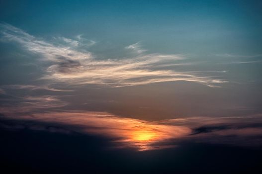 Sunset glow clouds in form of Ukraine map silhouette sky