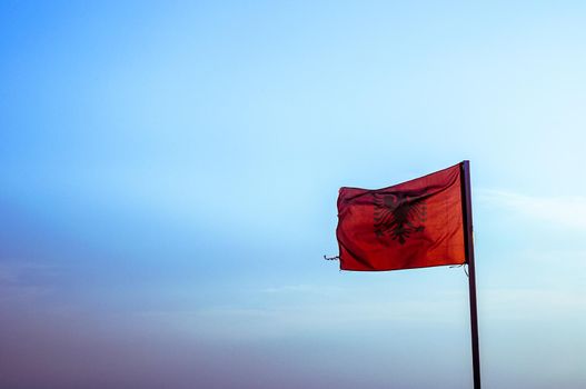 Albania flag waving blue sky backgrpound