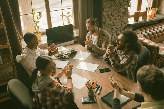 Happy Ending Of Successful Deal, Men And Woman Of Different Ethnic Groups Clap Their Hands In Agreement After Successful Brainstorming In Sunny Office Interior, Top View