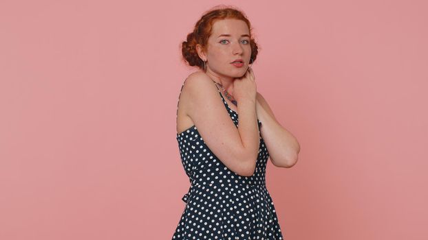 Scared fearful young redhead woman terrified about danger problems, suffering phobia, anxiety disorder, expresses fear, waving no, insecure, stress, panic. Ginger girl with freckles on pink background