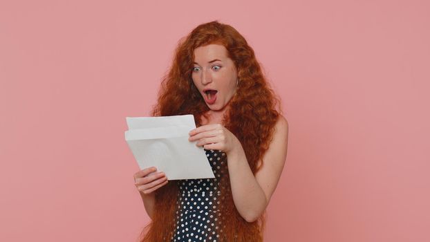 Woman Open Envelope Take Out Letter Reads It Feel Happy. Career Growth Advance Promotion Bank Loan Approve Monetary Award Long-Awaited Invitation Great News. Girl Isolated On Pink Studio Background