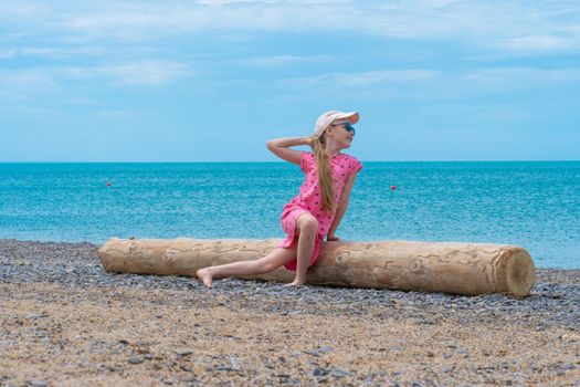 Log sea travel dress summer girl carefree little childhood water, for coast relax from smiling from wood kid, cute alone. Wave young cove,