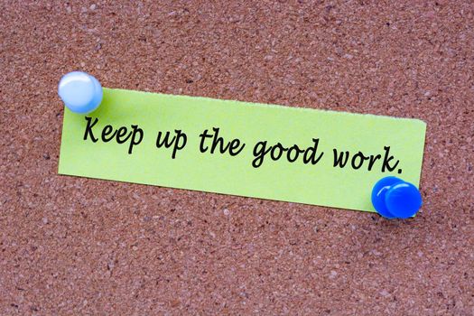 Keep up he good work words on stick note and pinned to a cork notice board. Encouragement words.