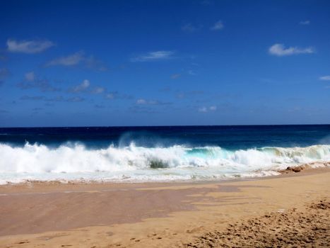 Waves crash on along Makapuu beach on Oahu, Hawaii.