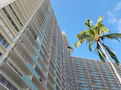 Waikiki - May 7, 2017: The Ilikai Hotel & Luxury Suites is a landmark oceanfront high rise hotel and condominium at the western end of Waikiki in Honolulu, Hawai'i. When it opened in 1964, the Ilikai was the first luxury high rise hotel in Hawai'i.[1]
The Ilikai is also well known, outside of Honolulu travelers and residents, for appearing prominently in the opening credits of the long running TV series Hawaii Five-O. The show's star, Jack Lord, is standing on the Ilikai penthouse balcony as the camera dramatically zooms in on him. This same sequence is used in the opening credits of the 2010 remake, with Alex O'Loughlin replacing Lord.