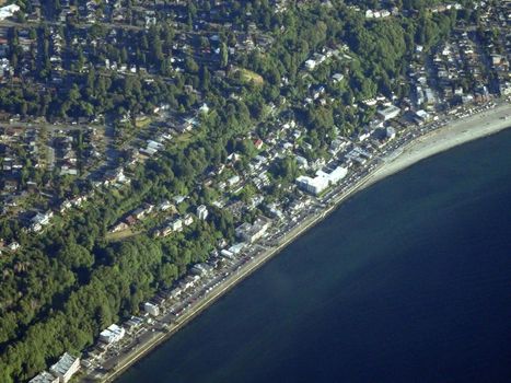 Aerial view of coastal Seattle with buildings, trees and roads on June 26, 2016 in Seattle, WA.