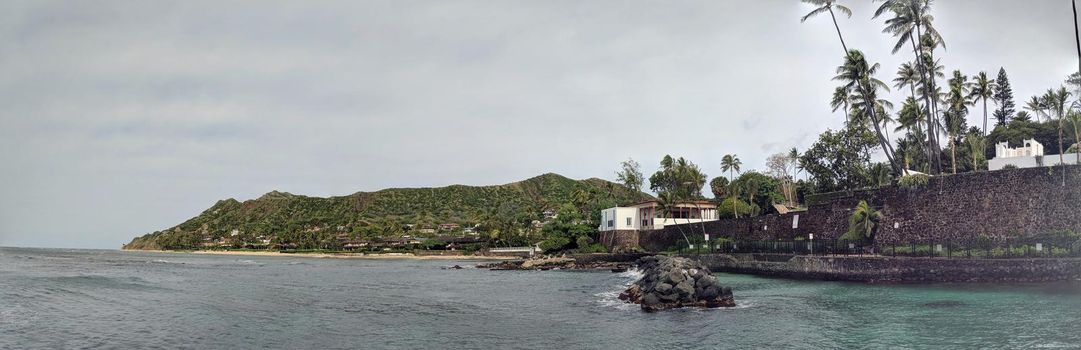 Diamond Head and Cromwell's Cove which is a popular swimming and diving spot east of Diamond Head Beach in Oahu, Hawaii. It is part of the Kaalawai Beach, known to most a Cromwell Beach, a narrow strip of golden sand fronting the upscale community of Ka’alawai.