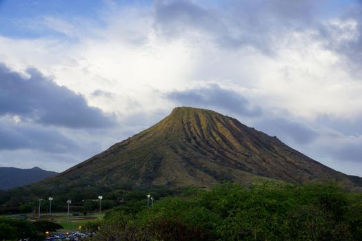 Koko Head Crater with stair trail up side visible on Oahu, Hawaii.  Koko Head is the headland that defines the eastern side of Maunalua Bay along the southeastern side of the Island of Oʻahu in Hawaiʻi. 