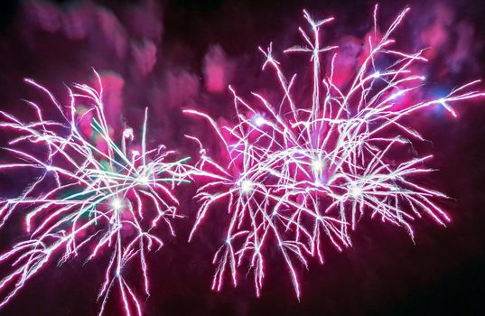 Colorful fireworks of various colors over night sky