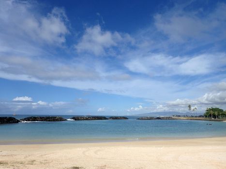 Beach on Magic Island in Ala Moana Beach Park on the island of Oahu, Hawaii.  On a beautiful day.