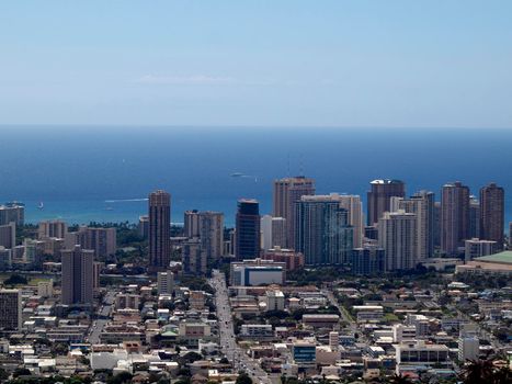 Honolulu - October 14, 2015:  Aerial of  Honolulu, Waikiki, Buildings, parks, hotels and Condos with Pacific Ocean and boats stretching into the distance on great day. 