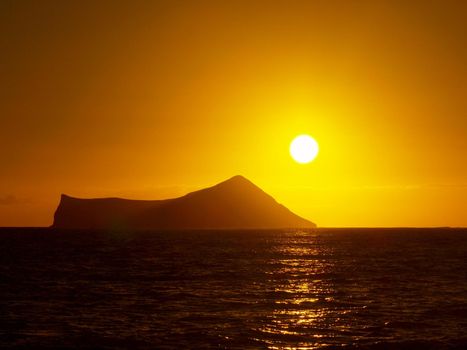 Sunrise over Rabbit (Manana) Island in Waimanalo Bay on Oahu.