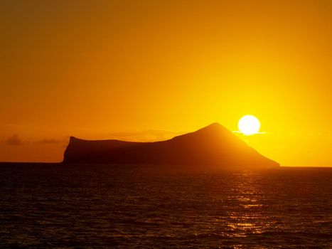 Sunrise over Rabbit (Manana) Island in Waimanalo Bay on Oahu.