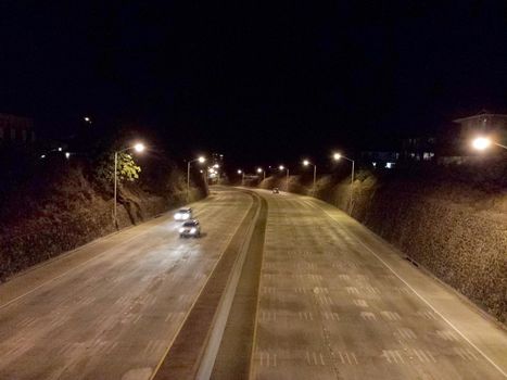 Cars move along H-1 Highway at Night in Kaimuki in Honolulu, Hawaii.