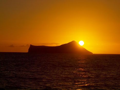 Sunrise over Rabbit (Manana) Island in Waimanalo Bay on Oahu.