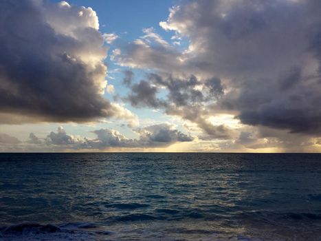 Shallow wavy ocean waters of Waimanalo bay looking into the pacific ocean at dawn on Oahu.