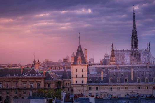Saint Chapelle and quarter latin parisian roofs at golden sunrise Paris, France