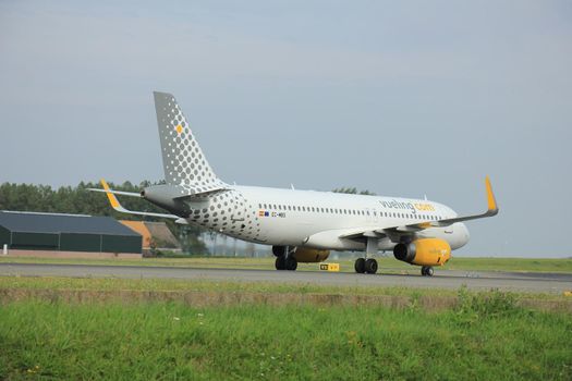 Amsterdam, The Netherlands - August 10 2015: EC-MBS Vueling Airbus A320-232 taxing on the Polderbaan runway to the main terminal of Amsterdam Schiphol Airport