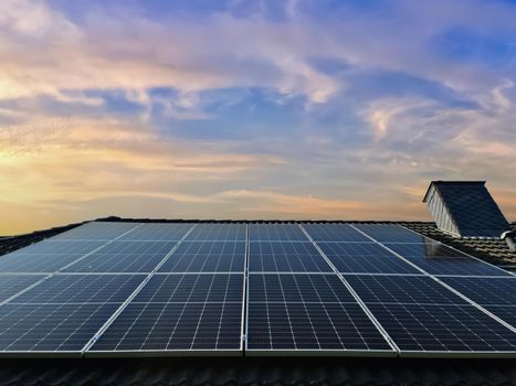 Solar panels producing clean energy on a roof of a residential house