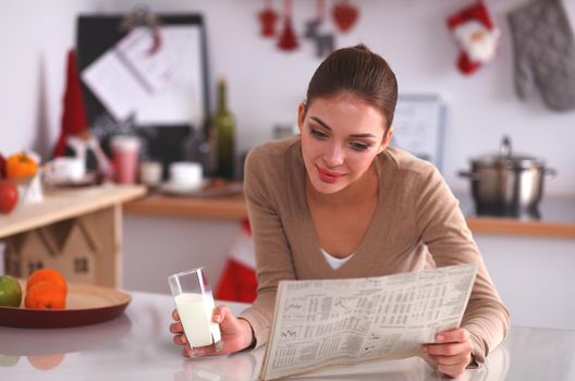 Нoung woman having healthy breakfast in kitchen