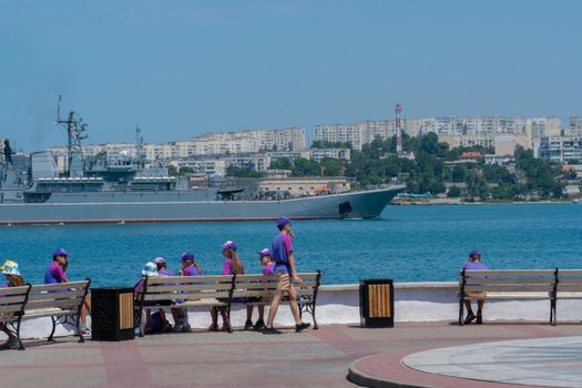 RUSSIA, CRIMEA - JUL 08, 2022: Russian russia sevastopol military group navy day sky sailing battleship, from black vessel for fleet from naval force, security nautical. Destroyer gray metal,