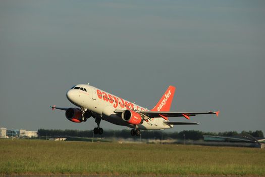 Amsterdam, the Netherlands  - June 1st, 2017: G-EZIY easyJet Airbus A319 taking off from Polderbaan Runway Amsterdam Airport Schiphol