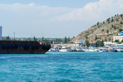 Balaklava port sevastopol russia crimea ship water vessel sea navy, from naval fleet in yacht and sky black, seascape lagoon. Russian weapon trade,