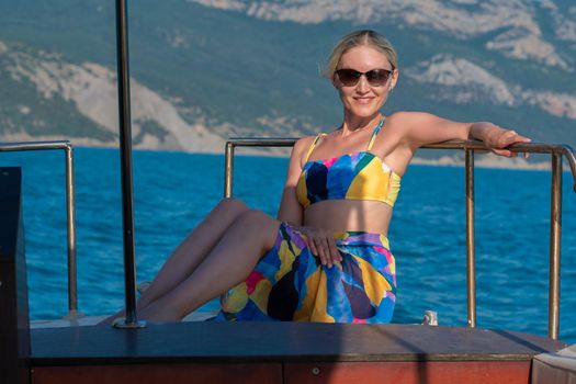 Swimsuit sea dress female glasses yacht vacation beautiful luxury blue, from deck wind for lady from cruise woman, rich relaxation. Yachting people trip,