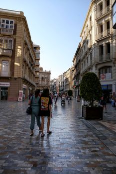 Cartagena, Murcia, Spain- July 18, 2022: Street of Cartagena called calle mayor next to city hall