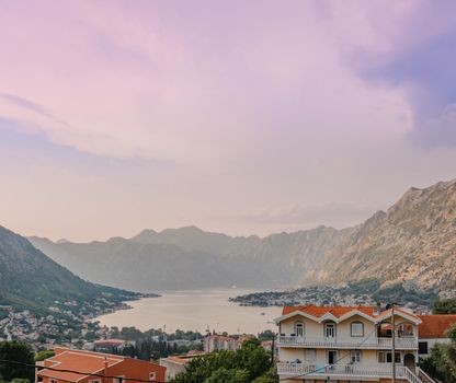 Sunset, beautiful landscape with silhouettes of trees. Travel concept. Montenegro, Kotor Bay. Sunset at Kotor Bay Montenegro. View of the sunset in Boko-Kotor Bay in Montenegro.