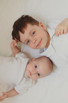 Two brothers lie lifestyle. An article about fraternal friendship. An article about the jealousy of brothers. An article about the age difference in children. An article about the relationship of children. Boys.
