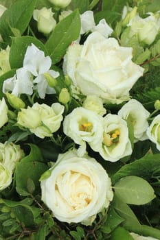 White roses and baby's-breath in a floral wedding decoration