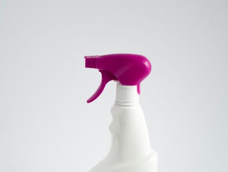 White blank plastic spray detergent bottle with a violet sprayer isolated on white background. Packaging template mockup