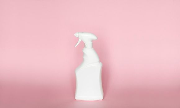 White blank plastic spray detergent bottle isolated on pink background. Packaging template mockup