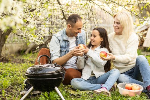 Happy family on summer picnic in park