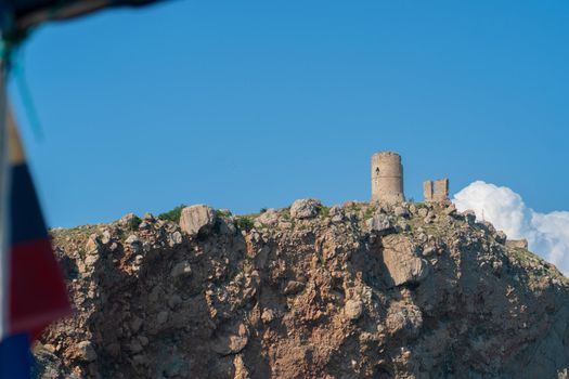 Crimea bay cembalo fortress balaklava flying balaclava mountain port rock, from shore tourist in landmark and beautiful building, coastline background. Embankment marina panoramic,