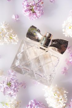 Perfume bottles with flowers . The choice of fragrance. Cosmetology. Cosmetic products. An article about perfume. Copy space.