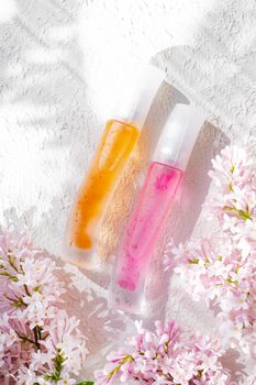 Perfume bottles with flowers . The choice of fragrance. Cosmetology. Cosmetic products. An article about perfume. Copy space.