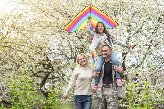 happy military family relaxing in the garden.