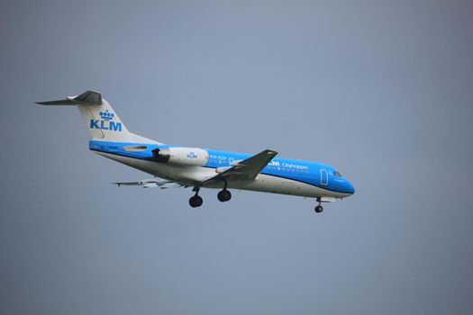 Amsterdam, the Netherlands - June 22nd 2017: PH-KZP KLM Cityhopper Fokker F70 approaching Polderbaan runway at Schiphol Amsterdam Airport, the Netherlands