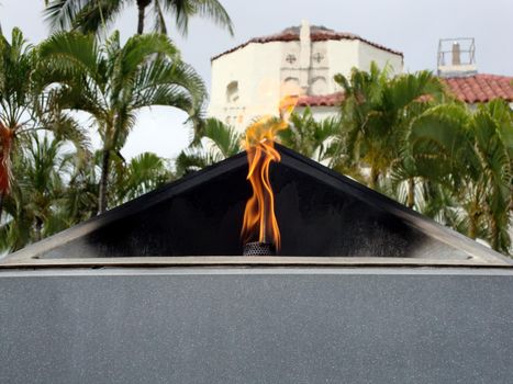 Honolulu - April 27, 2010: World Trade Center Memorial. Dedicated just two months after the attacks on 9-11-01, this simple but prominent memorial is located at the corner of Punchbowl and South King Streets fronting Honolulu Hale. Topped off by an eternal gas lit flame, the memorial was designed by City Managing Director Ben Lee and lit by Laura Brough's daughter Georgine Corrigan, along with her husband and two sons, who was killed in the air disaster of United flight 93 at Shanksville, Pennsylvania.