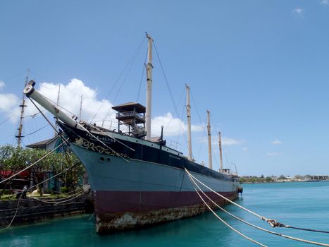 Historic Falls of Clyde Ship sits in Honolulu Harbor. Falls of Clyde is the last surviving iron-hulled, four-masted full rigged ship, and the only remaining sail-driven oil tanker. Designated a U.S. National Historic Landmark in 1989