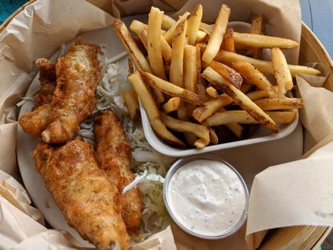 Beer Battered Fresh Fish & Chips.  Fresh fish, beer battered and deep fried. Served with french fries and dipping sauce.