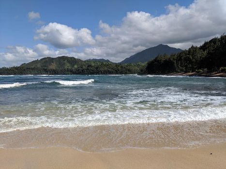 Wainiha Bay Park on Kauai, Hawaii.  Wainiha Bay in Kauai is the last bay after the town of Hanalei and on the road that leads toward the rugged Na Pali Coast State Park. Wainiha Bay and Wainiha Beach are accessible by driving on the coast road, narrow Highway 560, called the Kuhio Highway.