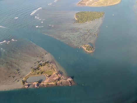 Aerial of Mokauea Fishing Village Island and Kalihi Channel of the coast of Oahu, Hawaii.