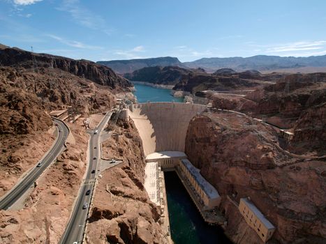 Aerial view of Hoover Dam, Lake Mead, and road leading to dam, a snapshot taken from bypass bridge on the border of Arizona and Nevada, USA. July 2011.