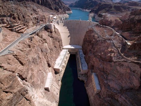 Aerial view of Hoover Dam, Lake Mead, and road leading to dam, a snapshot taken from bypass bridge on the border of Arizona and Nevada, USA. July 2011.