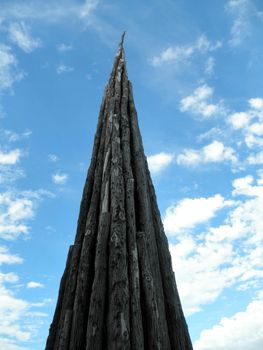 San Francisco, California - October 1, 2010:  Standing at 100 feet tall at its tapering peak, Spire is a sculpture by world-renowned artist Andy Goldsworthy.  in 2008 Goldsworthy selected 37 Monterey cypress trunks from trees felled at the site and meticulously fastened them together. 