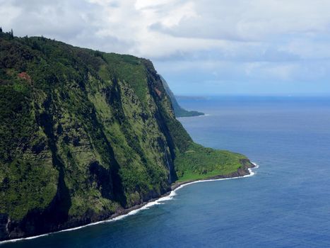 Waipi'o Black Sand Beach South.  Located on the northern Hamakua Coast, the sacred Waipio Valley was the boyhood home of King Kamehameha I, and an important center for political and religious life in Hawaii. Not only is "The Valley of the Kings" an important site for Hawaiian history and culture, it's also a place of dramatic tropical beauty. This fertile valley is about one mile across and over five-miles deep, and surrounded by cliffs up to 2000-feet high. 